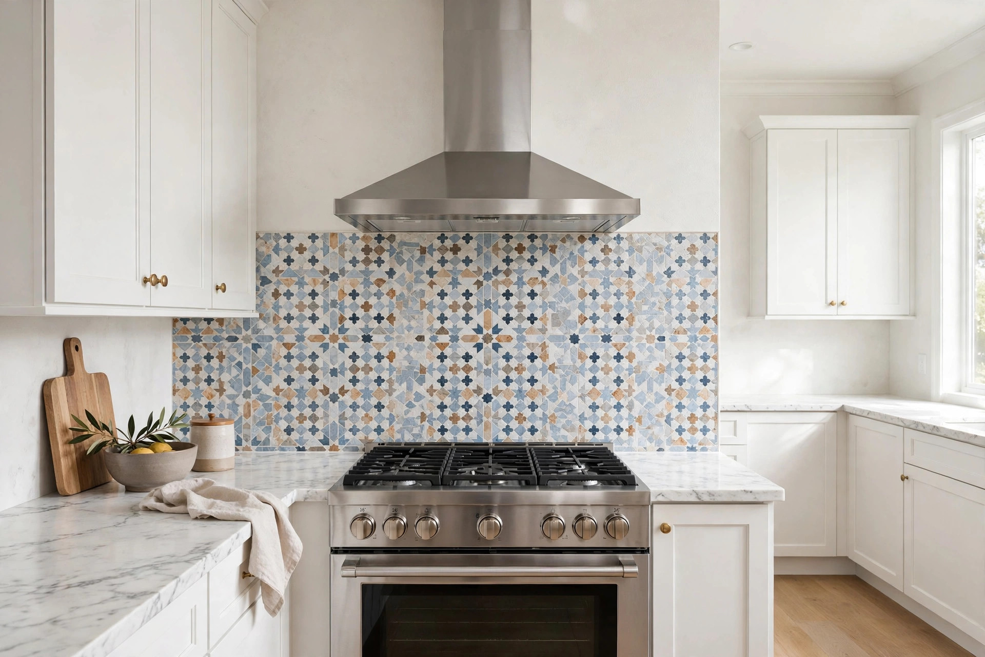 Mosaic tile backsplash behind the range