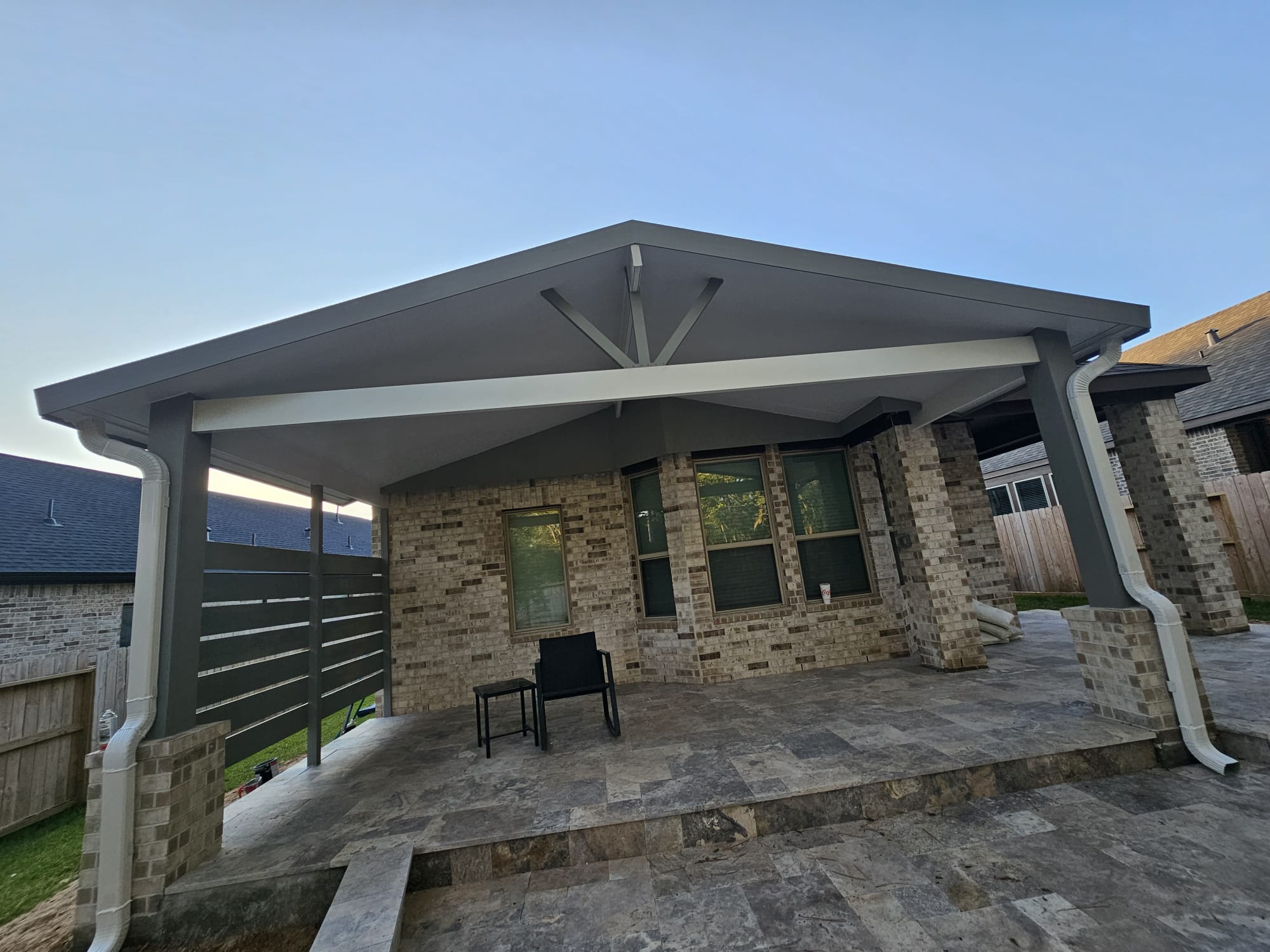 Aluminum patio cover on stone columns