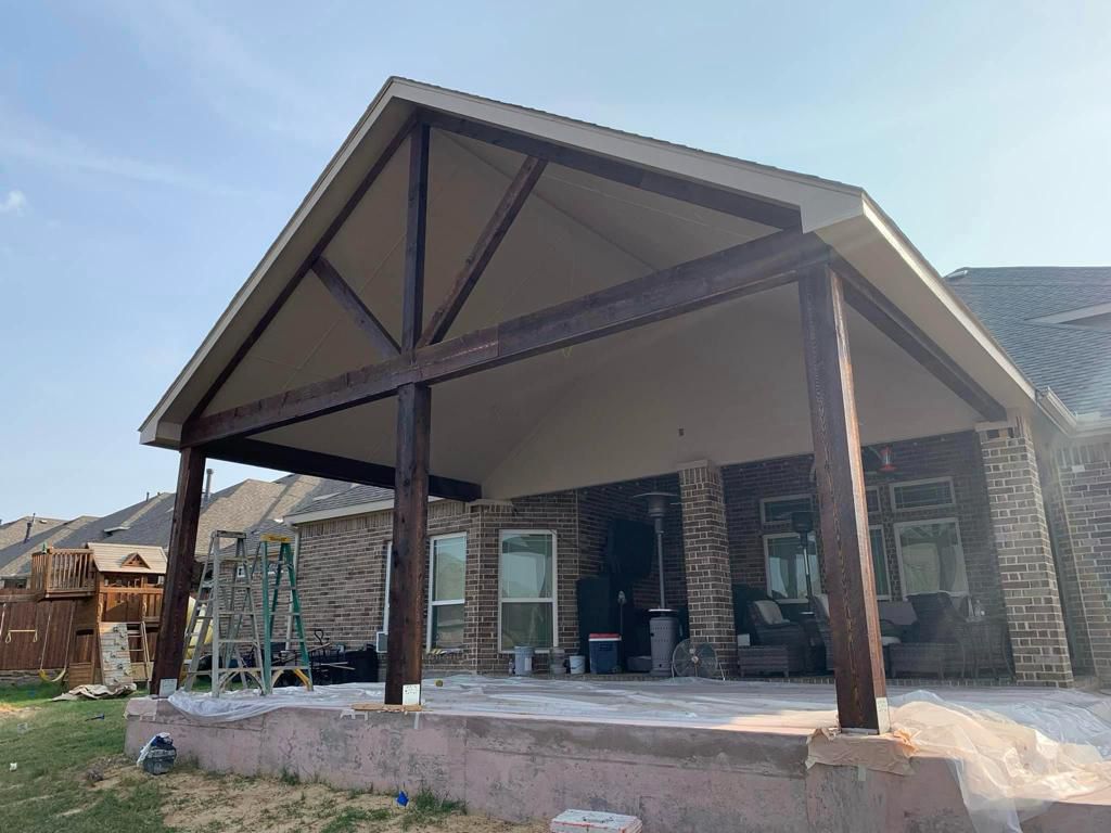 Dark stained wooden gable patio cover